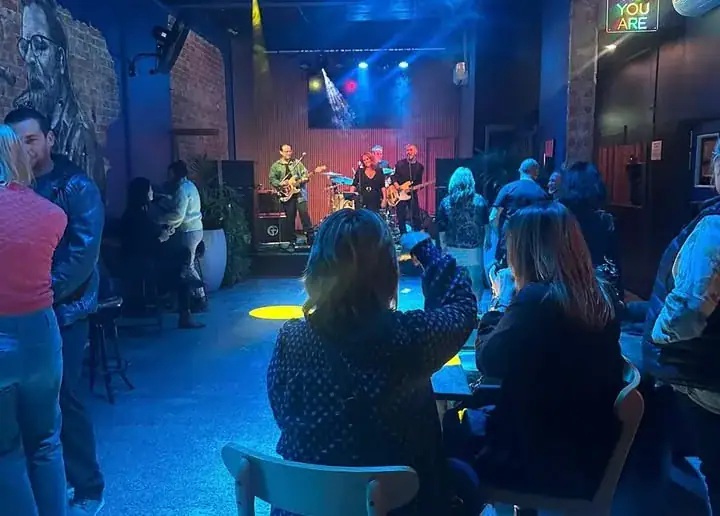 Crowd attending a private event and watching at a band at Common Room