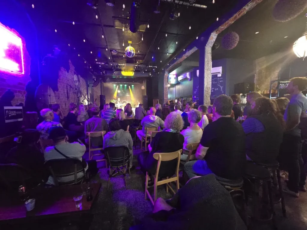 Crowd attending a private event and watching at a live performance at Common Room