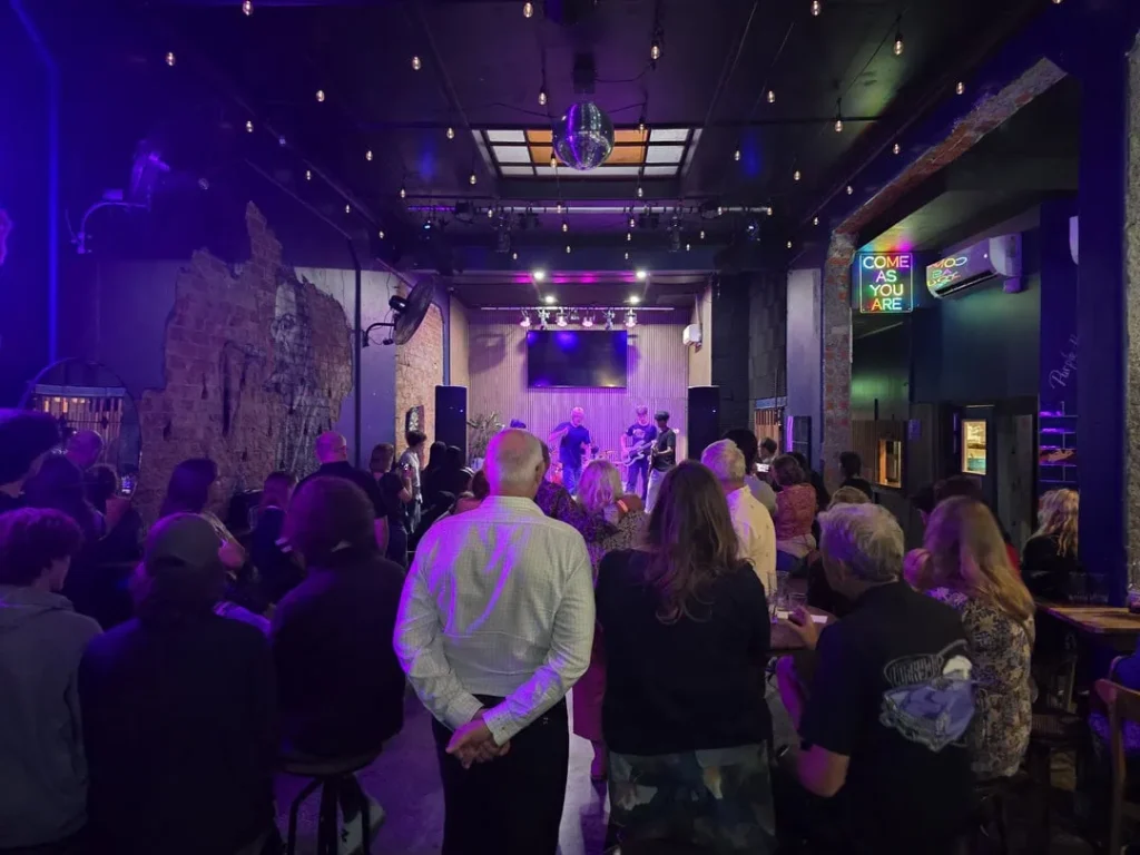 Crowd attending a private event and watching at a live performance at Common Room